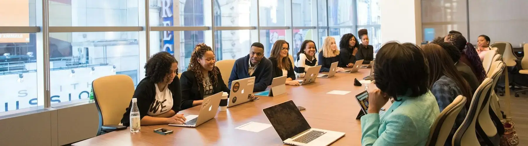 Team at a conference table for training